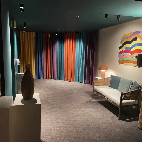 Drawing room with coloured drapes and bespoke furniture